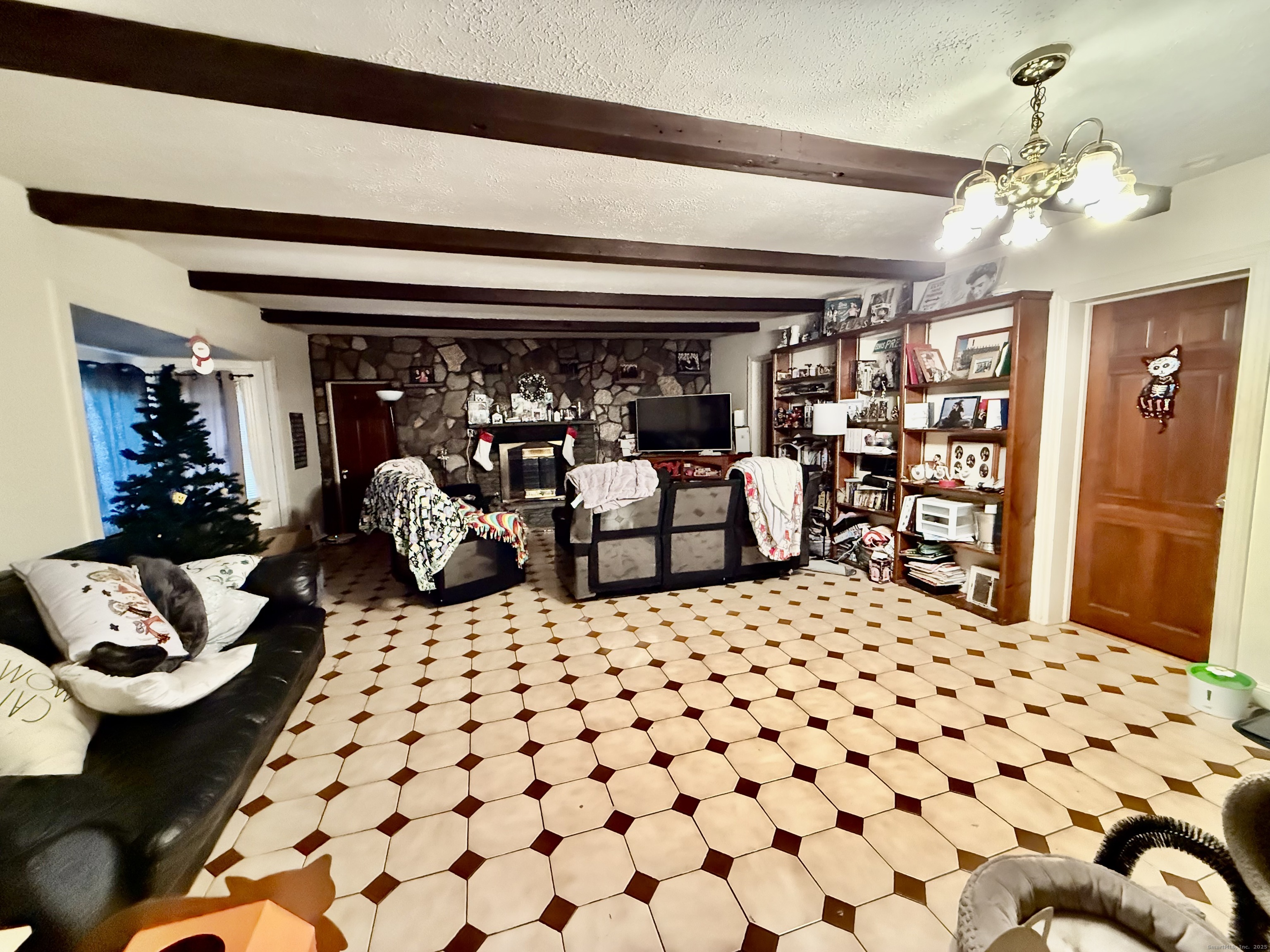 226 West High Street East Hampton, CT 06424 - Photo 8 of 21 a living room with furniture and a chandelier