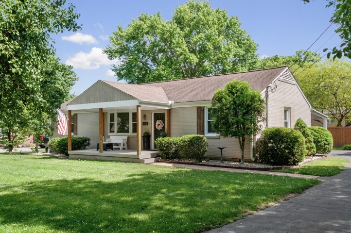 503 Perkins Drive Franklin, TN 37064 - Photo 1 of 40 a front view of a house with a yard and trees