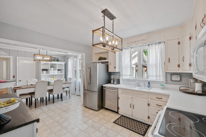 503 Perkins Drive Franklin, TN 37064 - Photo 15 of 40 a kitchen with white cabinets and sink