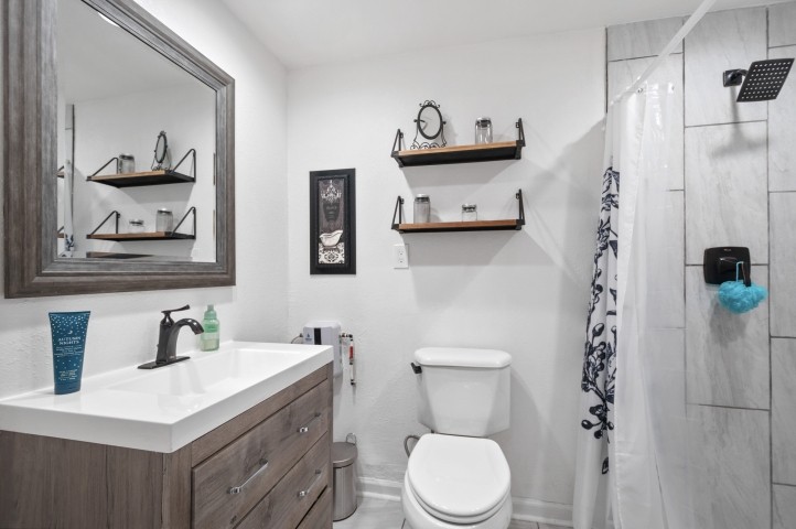 503 Perkins Drive Franklin, TN 37064 - Photo 24 of 40 a bathroom with a sink a toilet and shower curtain
