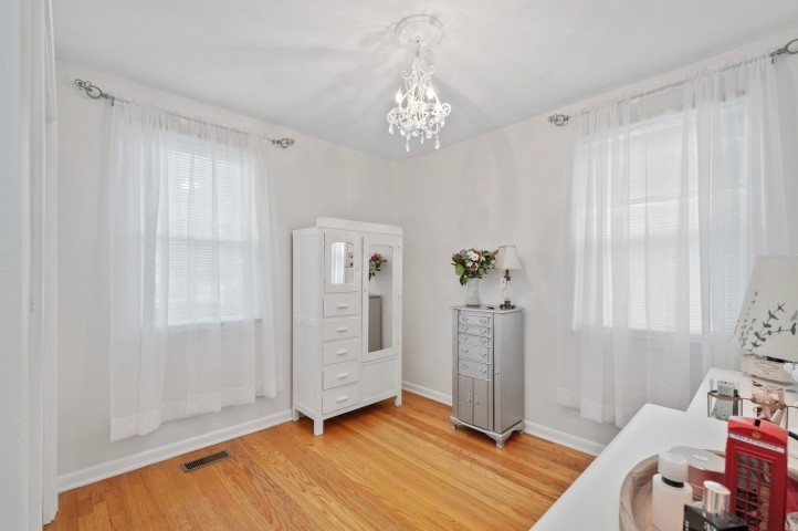 503 Perkins Drive Franklin, TN 37064 - Photo 28 of 40 a view of a livingroom with wooden floor and a chandelier