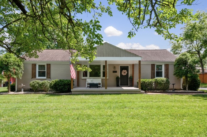 503 Perkins Drive Franklin, TN 37064 - Photo 3 of 40 a front view of a house with a yard and porch