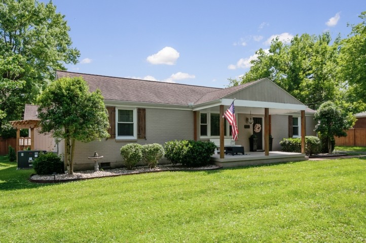 503 Perkins Drive Franklin, TN 37064 - Photo 4 of 40 a front view of a house with a yard and porch