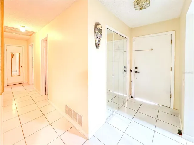 a bathroom with a sink a toilet a glass door and shower