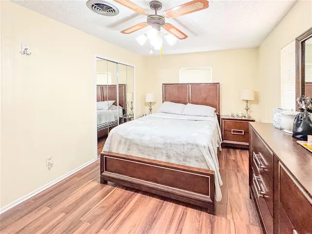 a view of a livingroom with furniture and floor to ceiling window
