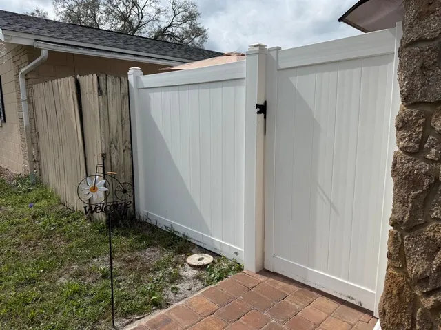 a view of an house with backyard space and garden