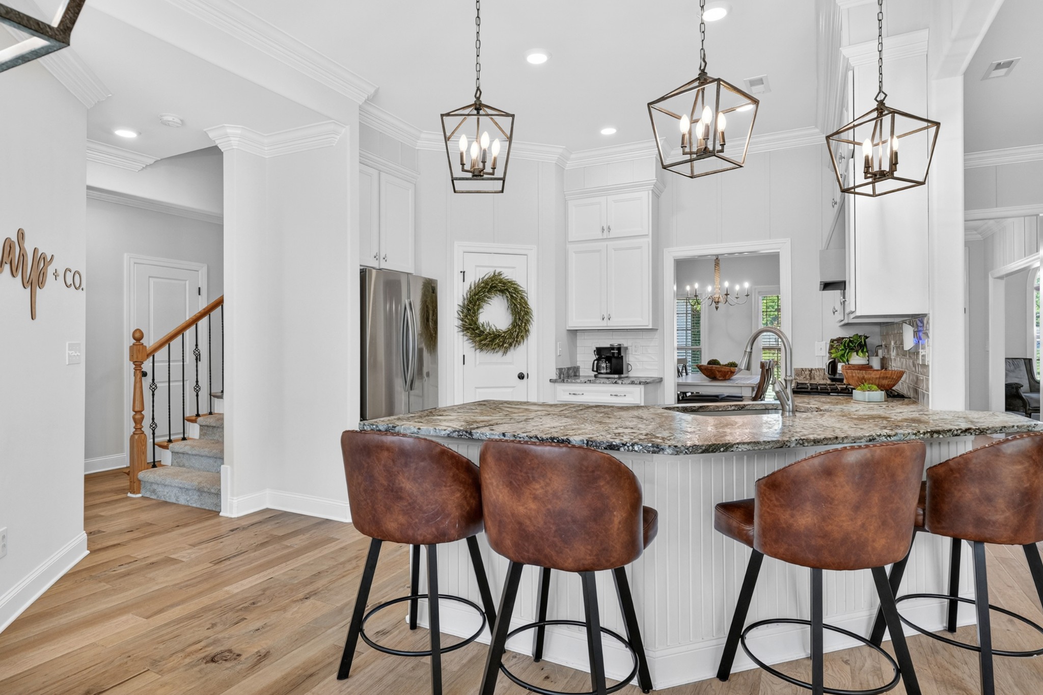 41 Knotting Hill Road Fayetteville, TN 37334 - Photo 17 of 65 a kitchen with stainless steel appliances kitchen island granite countertop a table and chairs in it