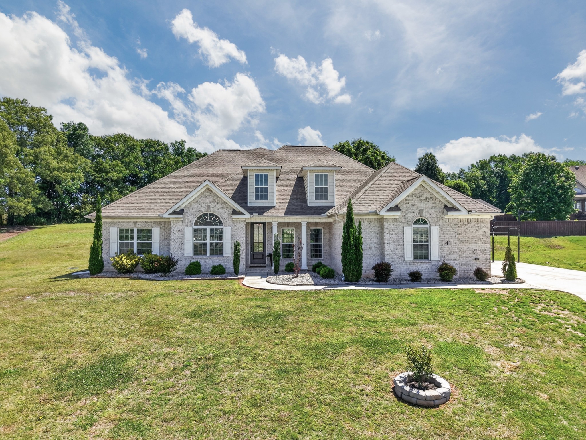41 Knotting Hill Road Fayetteville, TN 37334 - Photo 2 of 65 a front view of a house with a yard and trees