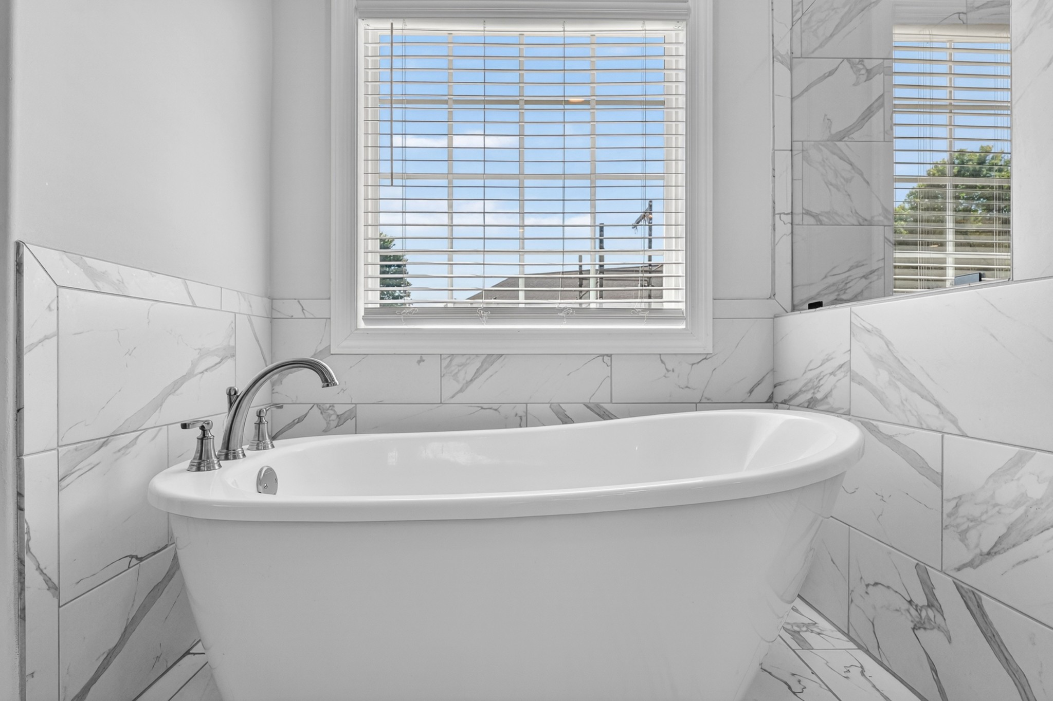 41 Knotting Hill Road Fayetteville, TN 37334 - Photo 42 of 65 a white bath tub sitting in a bathroom next to a window