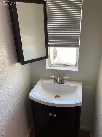 a view of a room with a ceiling fan