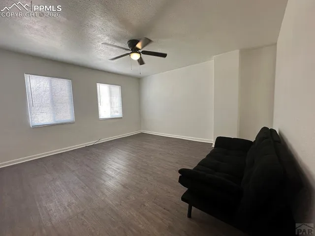 a kitchen with stainless steel appliances granite countertop a refrigerator and a stove
