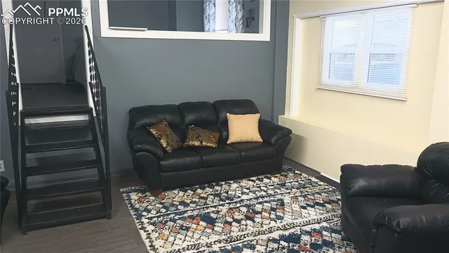 a living room with furniture and a window