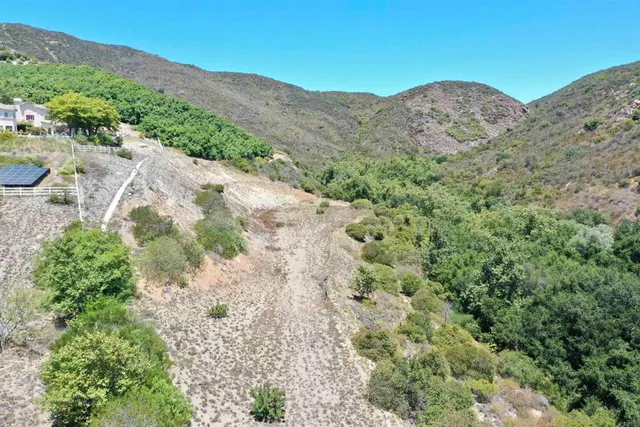 a view of a mountain with a mountain in the background