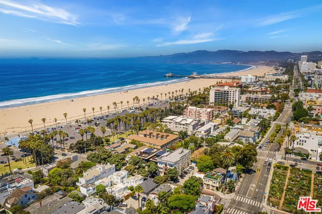 a view of a white house with a yard