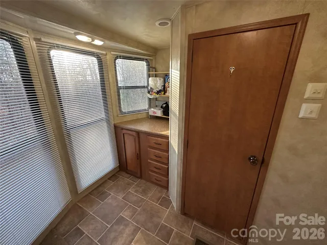 a bathroom with a shower and a sink