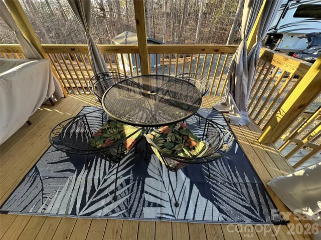 a view of a balcony with furniture