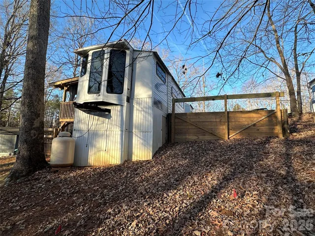 a view of a storage house and a yard