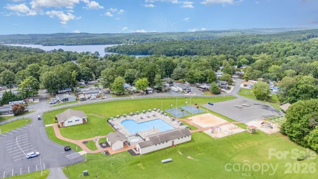 a view of a swimming pool and a yard