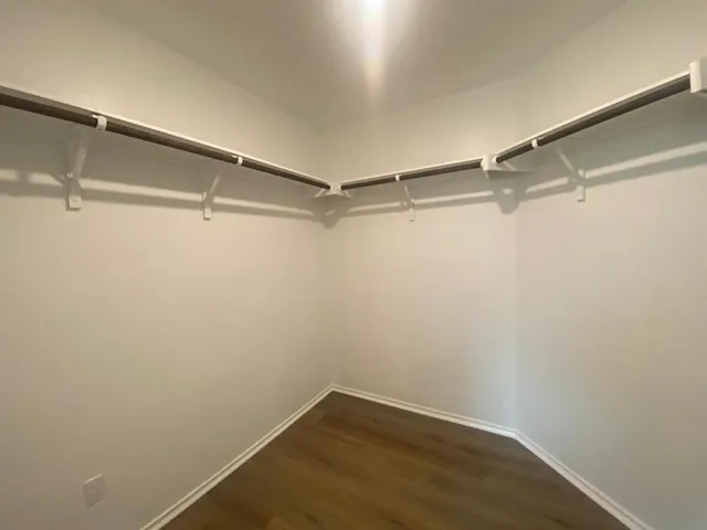 a view of a room with shelf on the wall