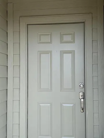 a hallway with white doors