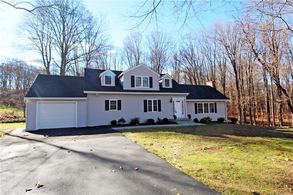 11 Brennan Road Newtown, CT 06470 - Photo 1 of 1 a front view of a house with a yard balcony and large tree