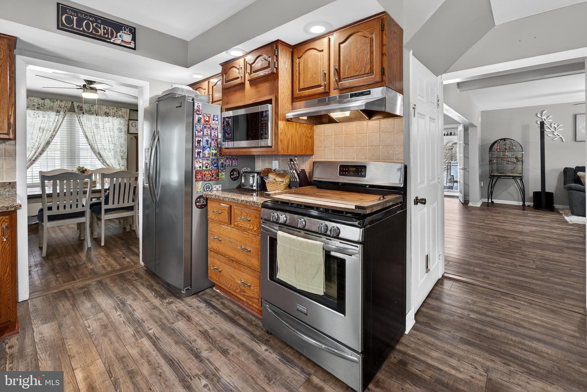 115 South Walnut Avenue Maple Shade, NJ 08052 - Photo 12 of 30 a kitchen with stainless steel appliances granite countertop a stove and a refrigerator