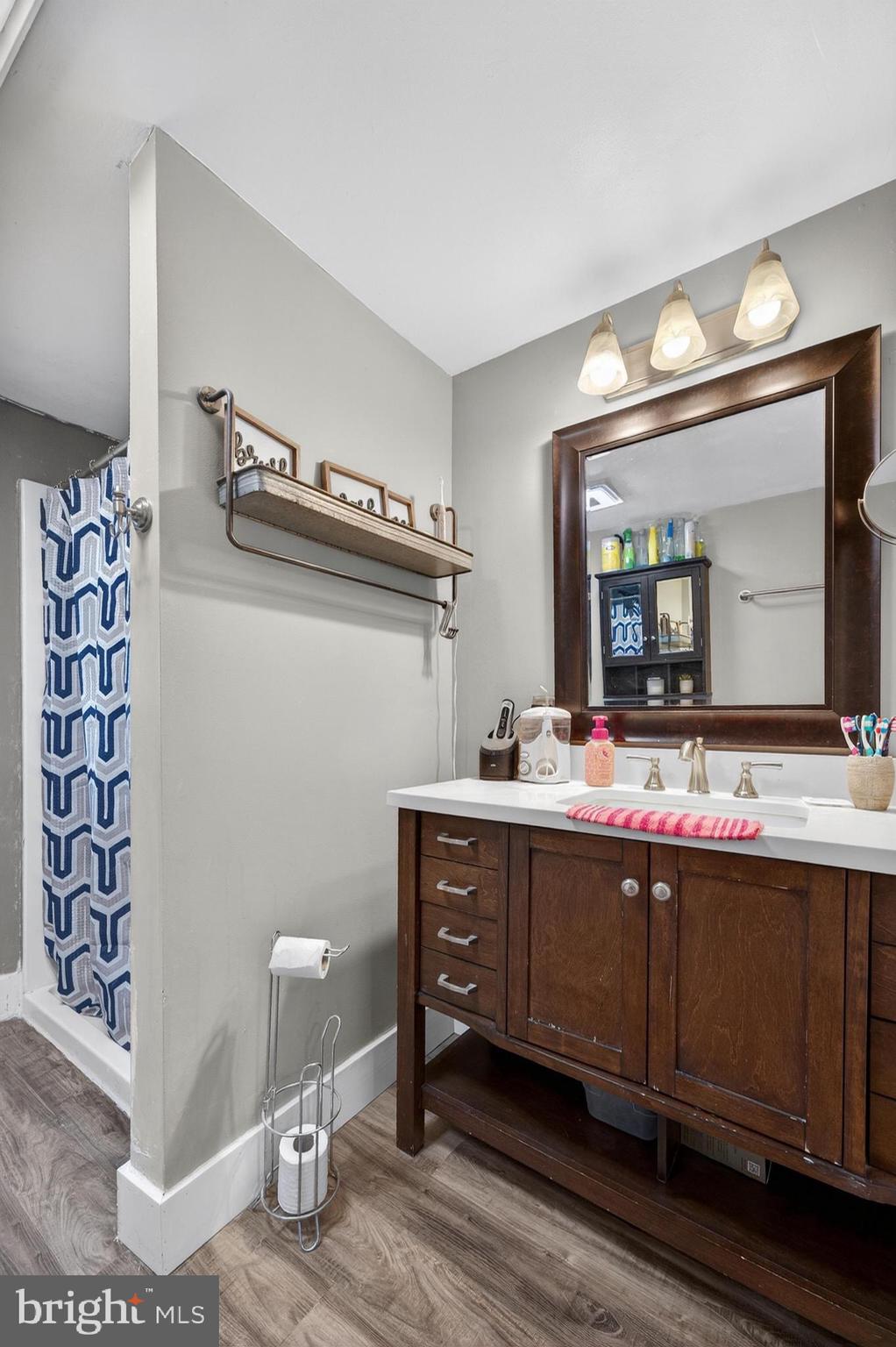 115 South Walnut Avenue Maple Shade, NJ 08052 - Photo 25 of 30 a bathroom with a sink and a mirror