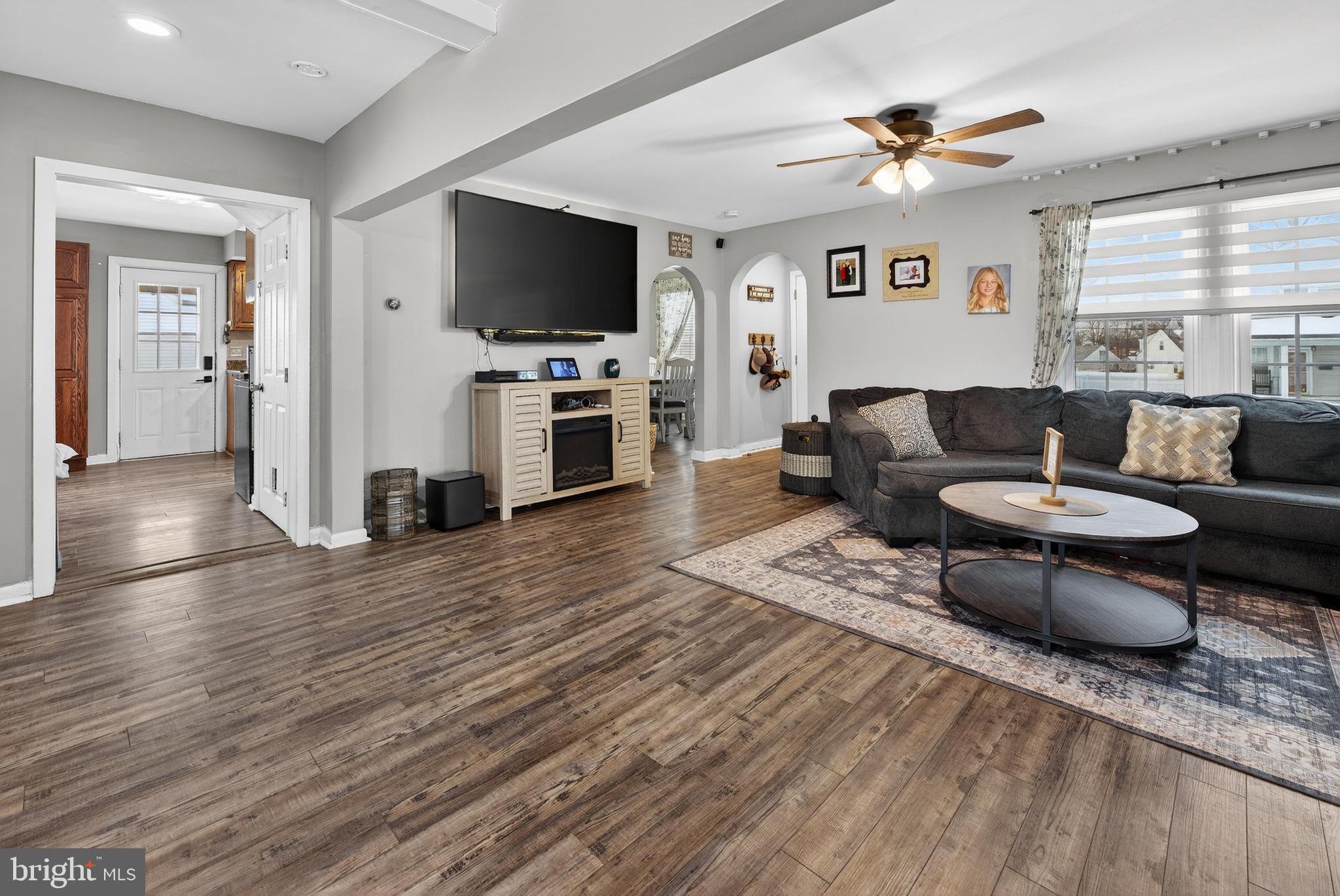 115 South Walnut Avenue Maple Shade, NJ 08052 - Photo 5 of 30 a living room with furniture a fireplace and a flat screen tv