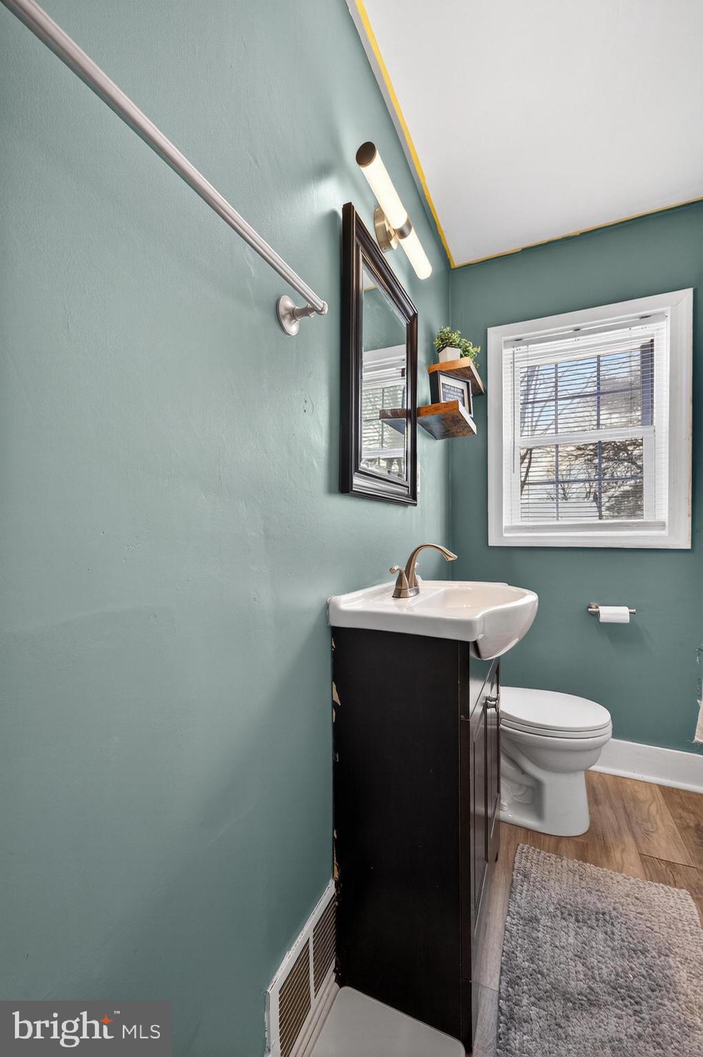 115 South Walnut Avenue Maple Shade, NJ 08052 - Photo 7 of 30 a bathroom with a sink toilet and mirror