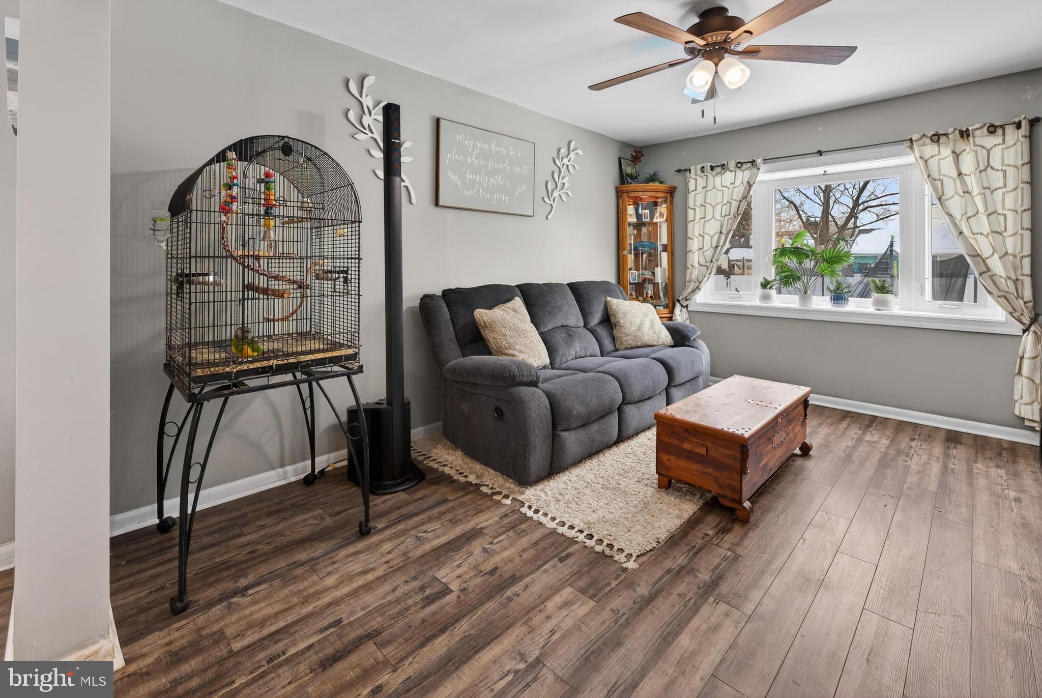 115 South Walnut Avenue Maple Shade, NJ 08052 - Photo 9 of 30 a living room with furniture a table and a large window