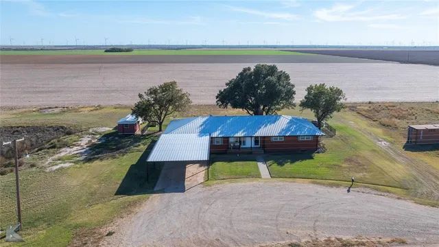 a view of a balcony with two chairs