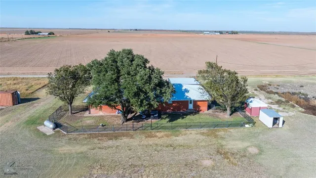 a view of a ocean with a mountain in the background