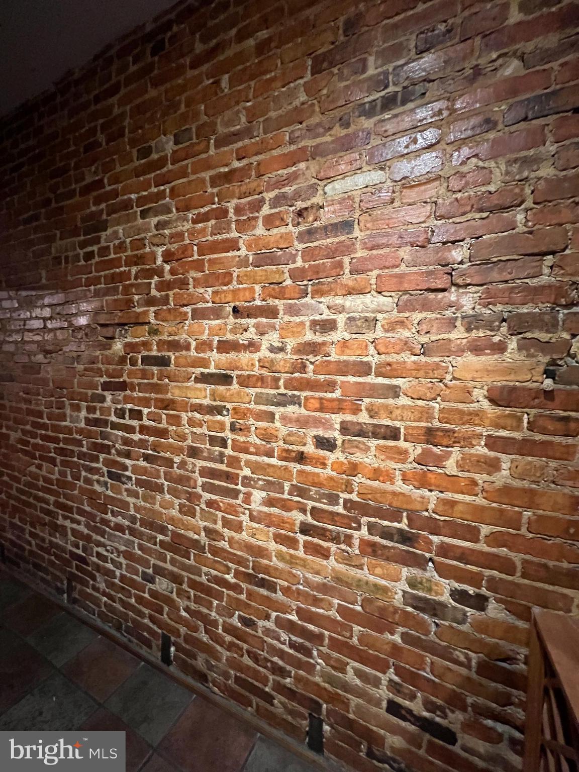 1908 Madison Avenue Baltimore, MD 21217 - Photo 10 of 31 a bathroom with a brick wall