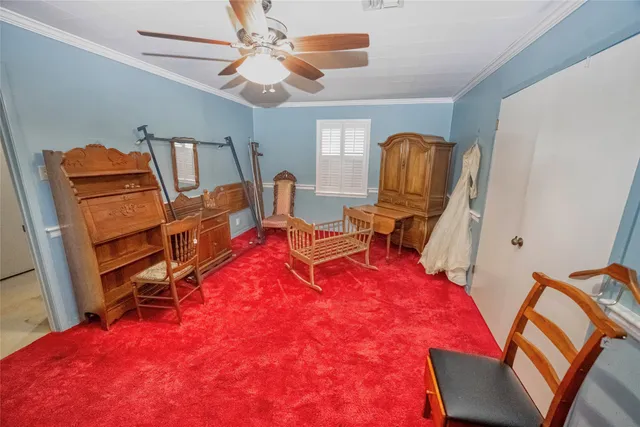 a living room with furniture a flat screen tv and a dresser