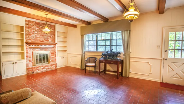 a living room with furniture and a window