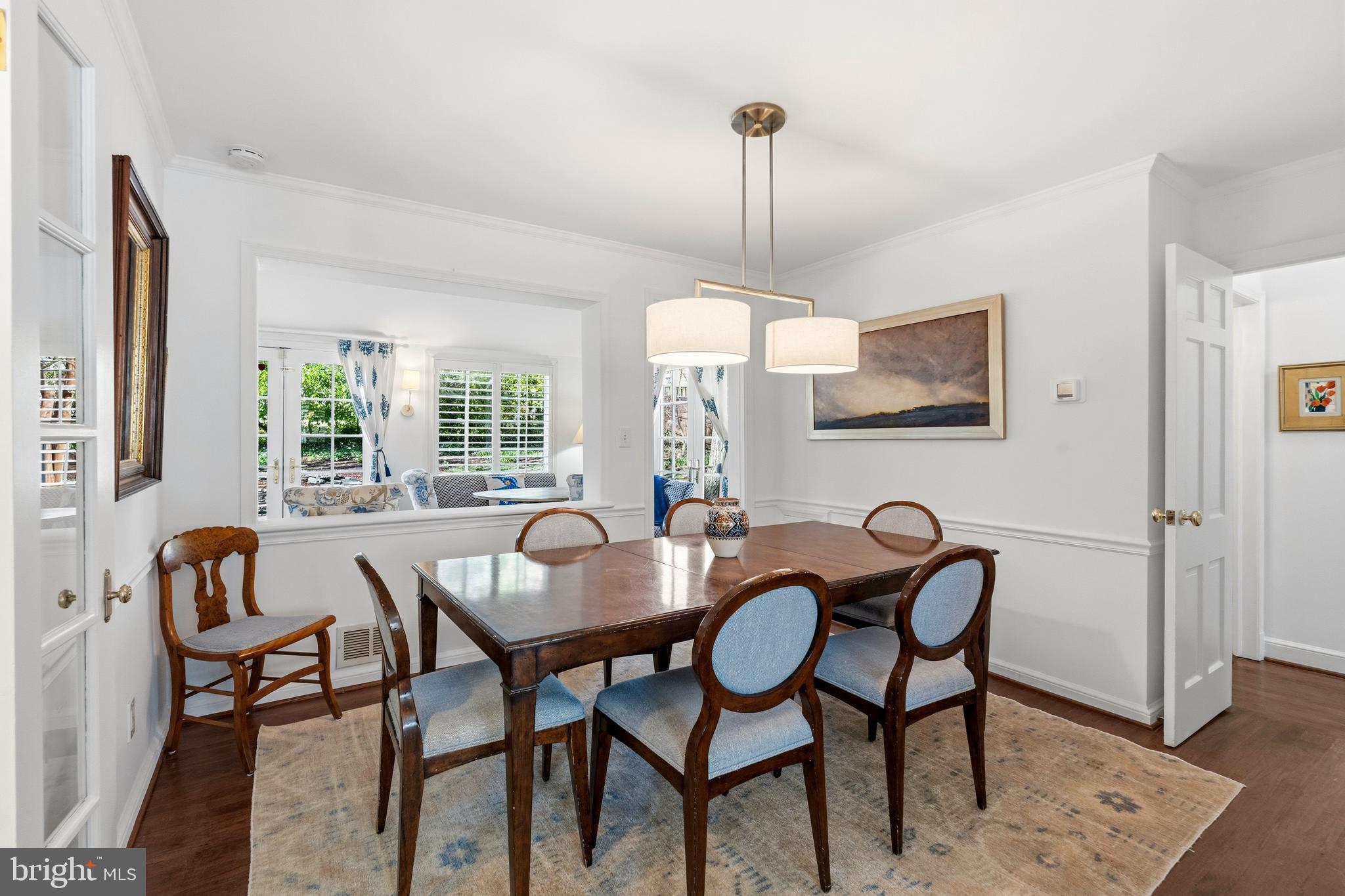 402 Skyhill Road Alexandria, VA 22314 - Photo 6 of 42 Formal dining room with modern chandelier
