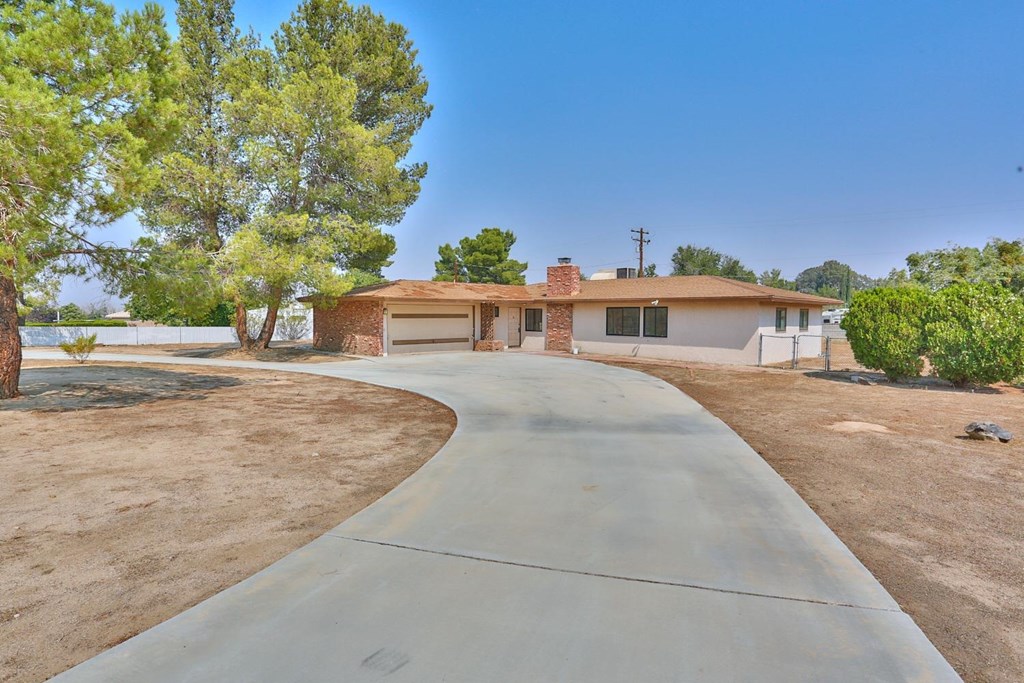 18564 Cocqui Road Apple Valley, CA 92307 - Photo 1 of 1 front view of a house with a yard