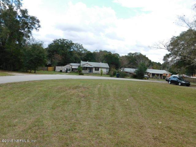 9770 Lily Road Jacksonville, FL 32246 - Photo 11 of 53 a view of outdoor space with deck and yard