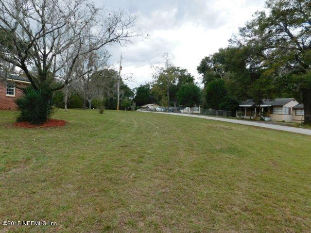 9770 Lily Road Jacksonville, FL 32246 - Photo 12 of 53 a view of outdoor space with deck and yard