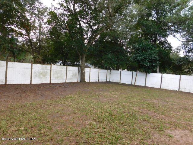 9770 Lily Road Jacksonville, FL 32246 - Photo 16 of 53 a view of yard and tree