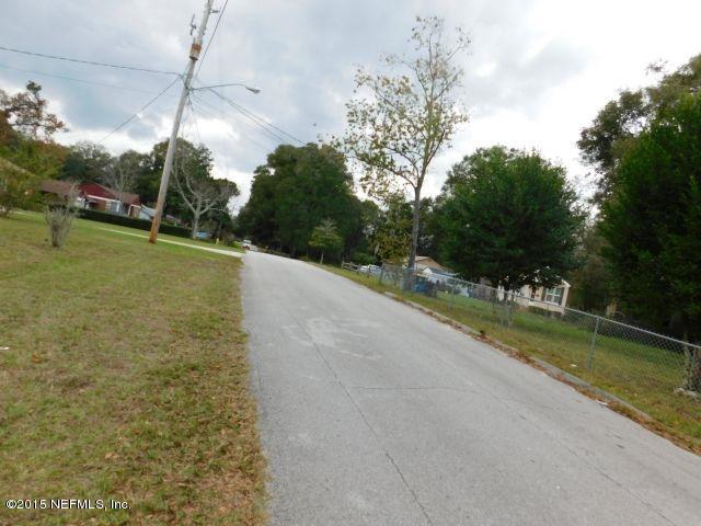9770 Lily Road Jacksonville, FL 32246 - Photo 19 of 53 a view of a yard with a tree