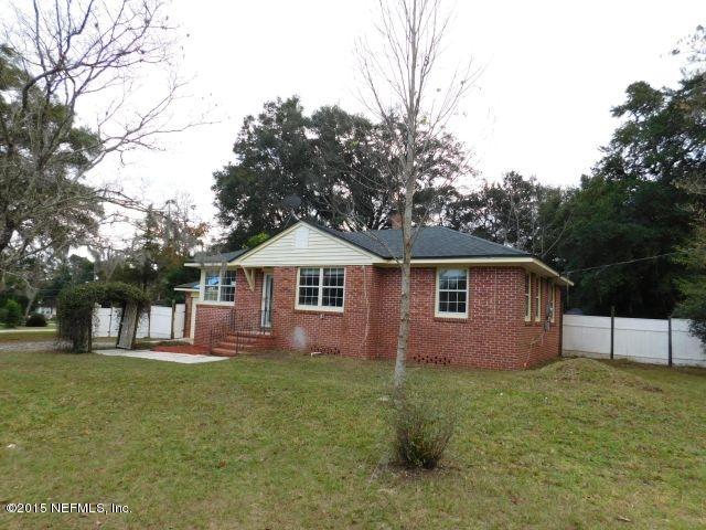 9770 Lily Road Jacksonville, FL 32246 - Photo 2 of 53 a front view of a house with a garden