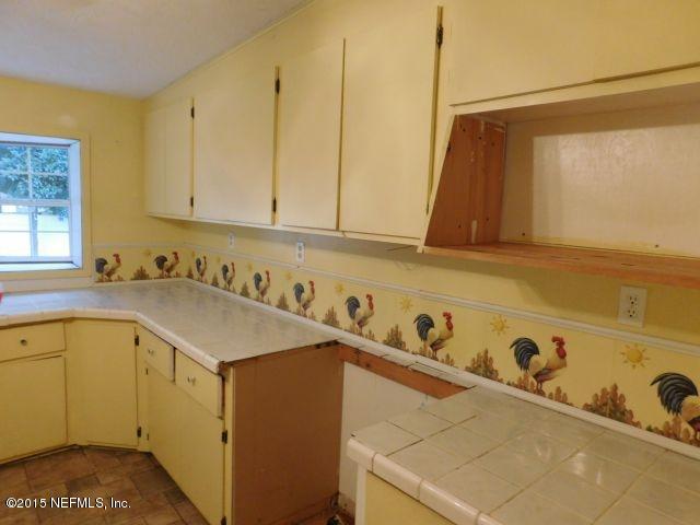 9770 Lily Road Jacksonville, FL 32246 - Photo 31 of 53 a utility room with dryer and washer