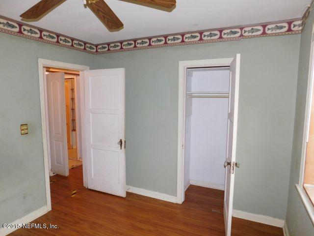 9770 Lily Road Jacksonville, FL 32246 - Photo 33 of 53 a view of a hallway with wooden floor