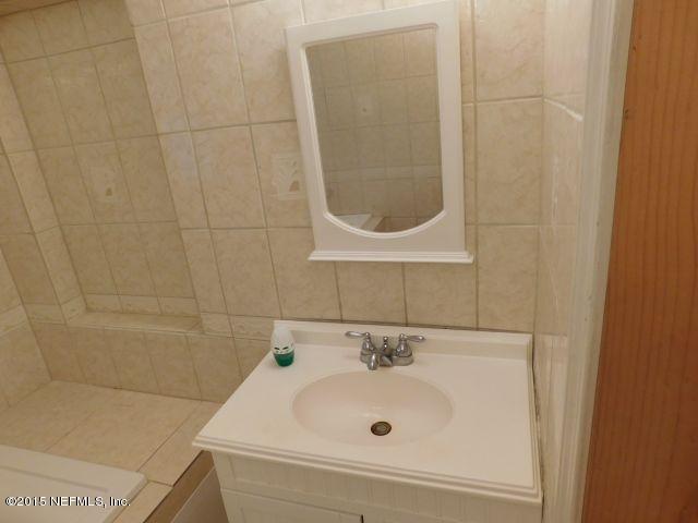 9770 Lily Road Jacksonville, FL 32246 - Photo 41 of 53 a bathroom with a sink and a window