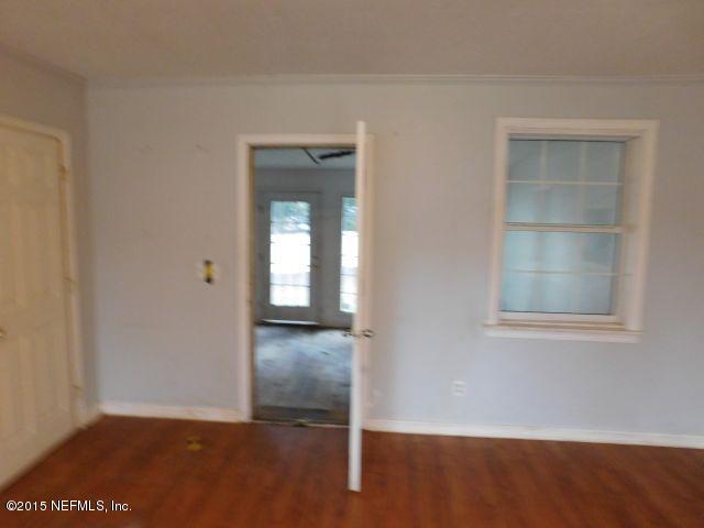 9770 Lily Road Jacksonville, FL 32246 - Photo 46 of 53 an empty room with windows