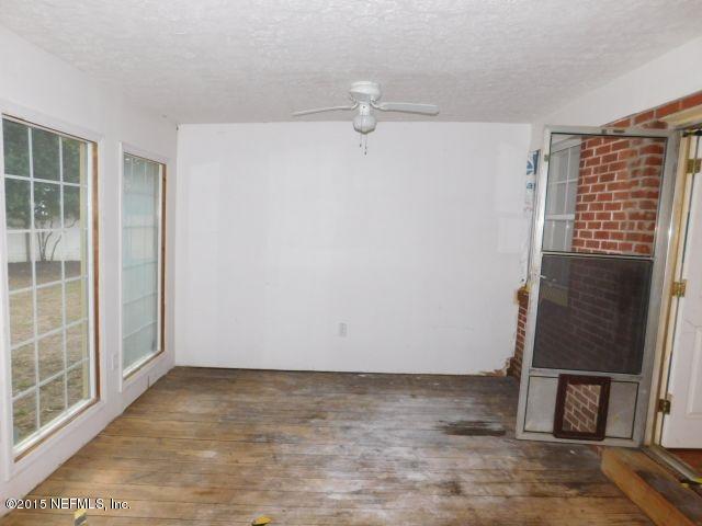 9770 Lily Road Jacksonville, FL 32246 - Photo 48 of 53 an empty room with windows
