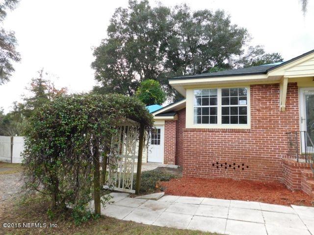 9770 Lily Road Jacksonville, FL 32246 - Photo 5 of 53 a front view of a house with a yard