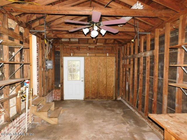 9770 Lily Road Jacksonville, FL 32246 - Photo 53 of 53 a view of a room with wooden walls