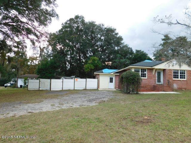 9770 Lily Road Jacksonville, FL 32246 - Photo 6 of 53 a view of a house with a yard